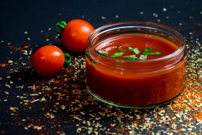 tomato and tomato puree with parsley in bowl sauce google meet background