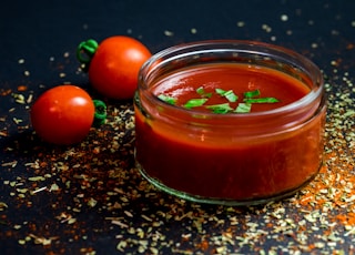 tomato and tomato puree with parsley in bowl