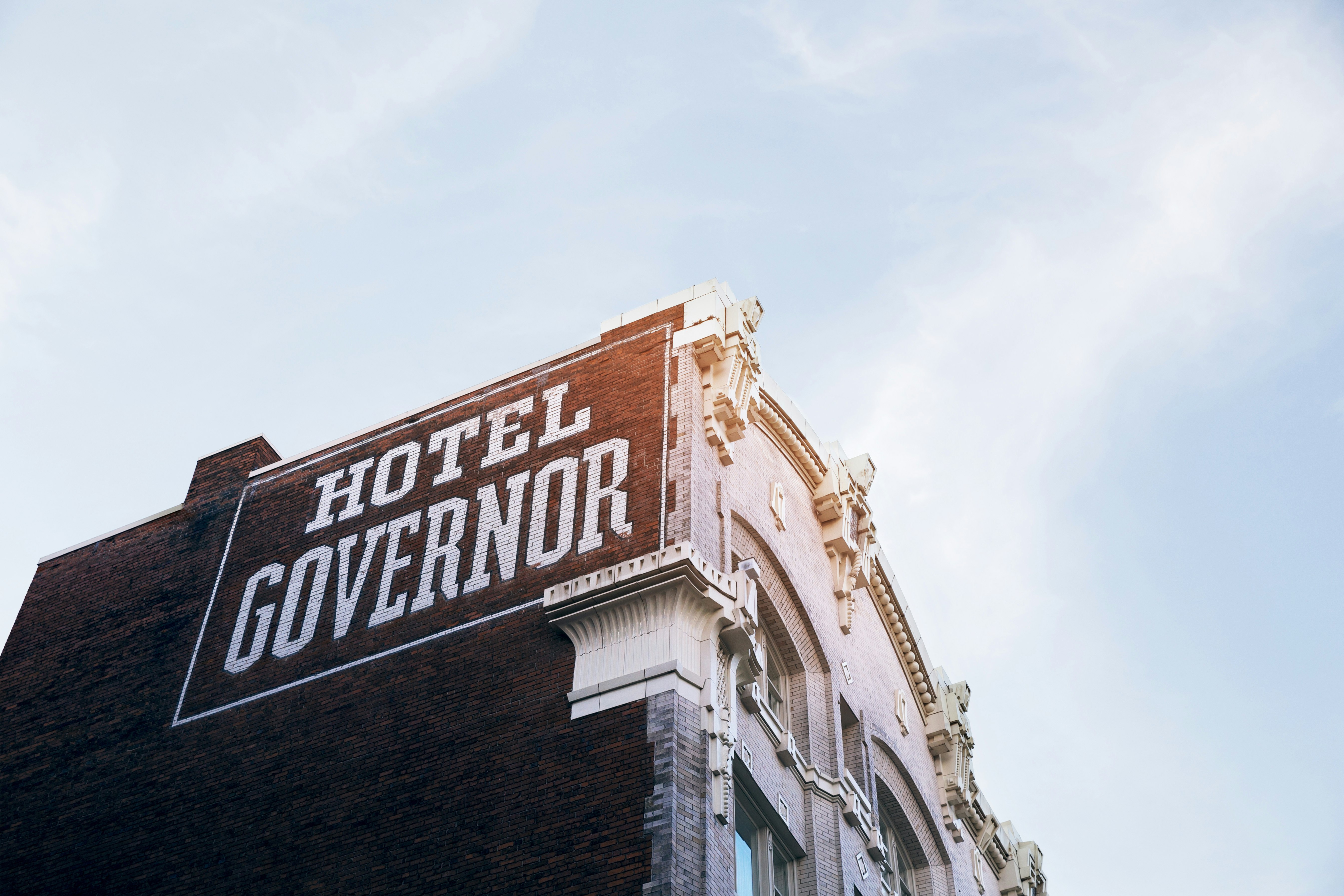 hotel governor building at daytime low angle photography