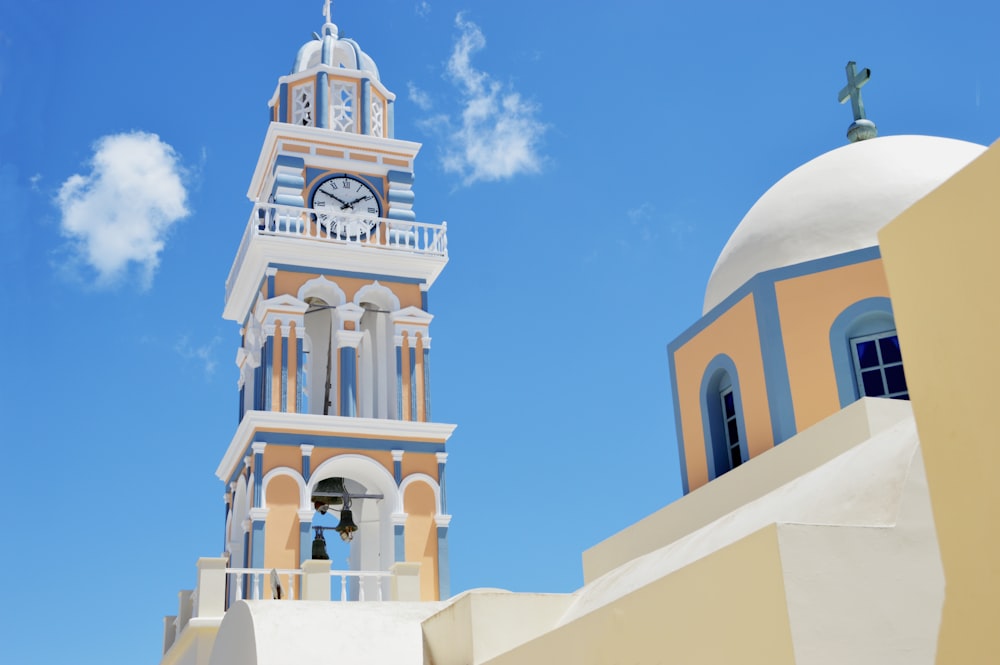 white and yellow concrete tower and dome building