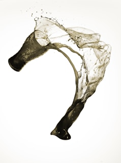 Dynamic splash of liquid symbolizing the intense effect of Kriko.