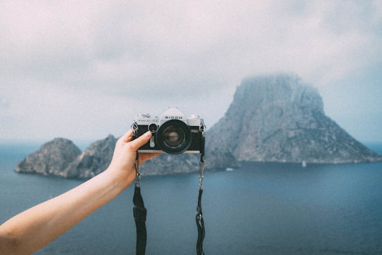person taking selfie with camera in Es Vedra Island Spain