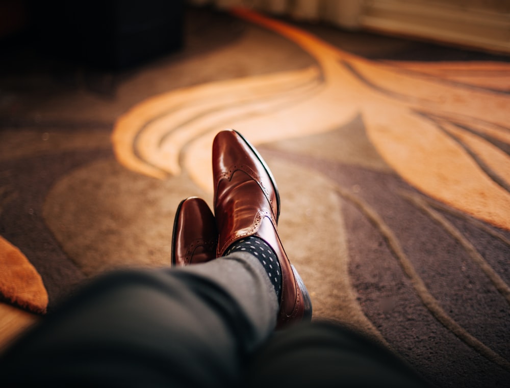 pair of brown leather dress shoes