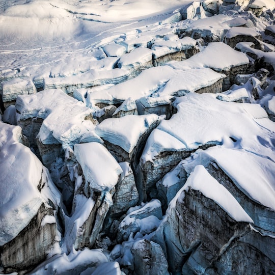 mountain filled with snow during daytime in Fiordland National Park New Zealand