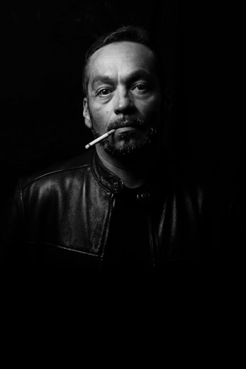 man wearing black leather jacket