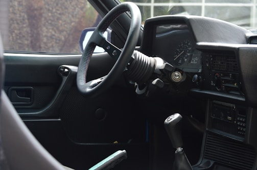 A close-up of a car's dashboard and controls.