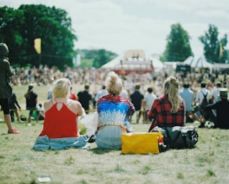 group of people on grass field under sunny day