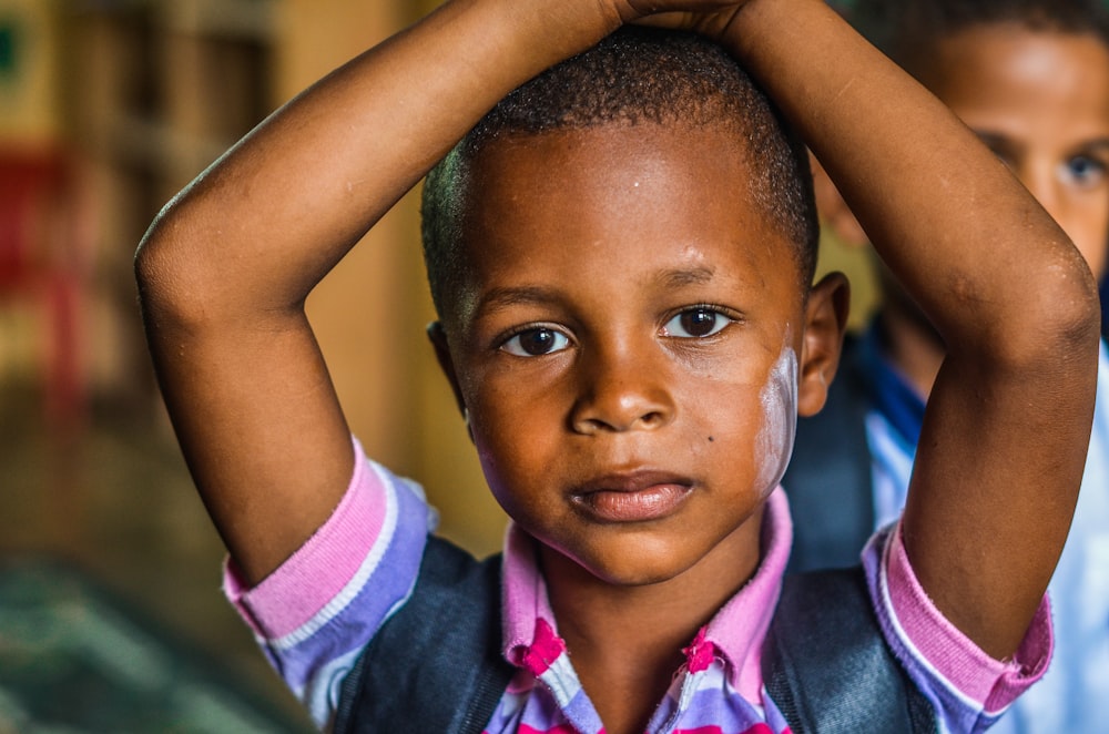 close-up photography of boy wearing backpack