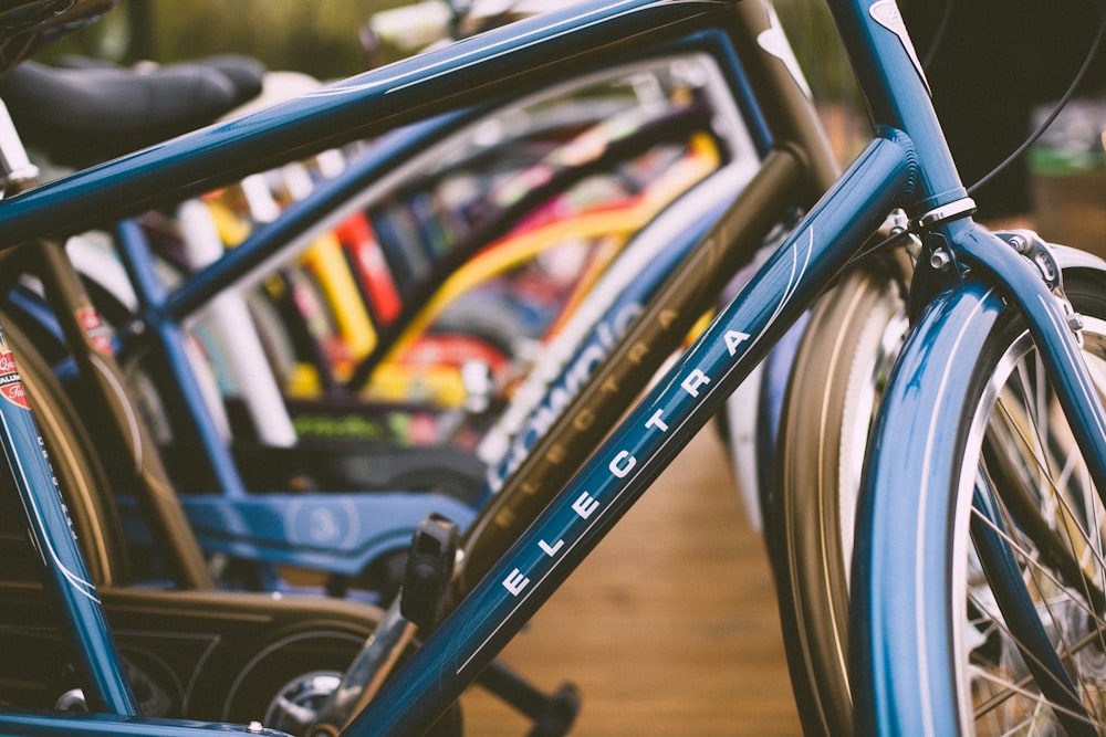 close shot of blue and white Electra bicycle