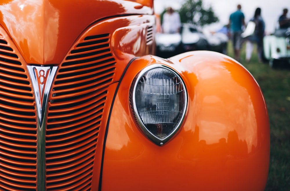 vintage orange car during daytime