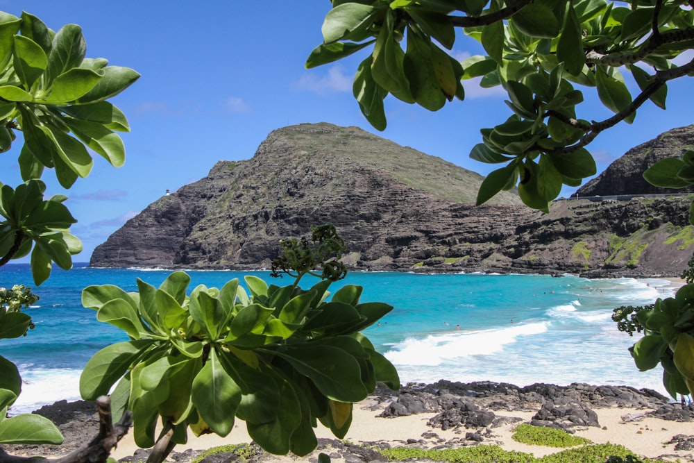 A beautiful isolated beach surrounded by mountains in Hawaii.