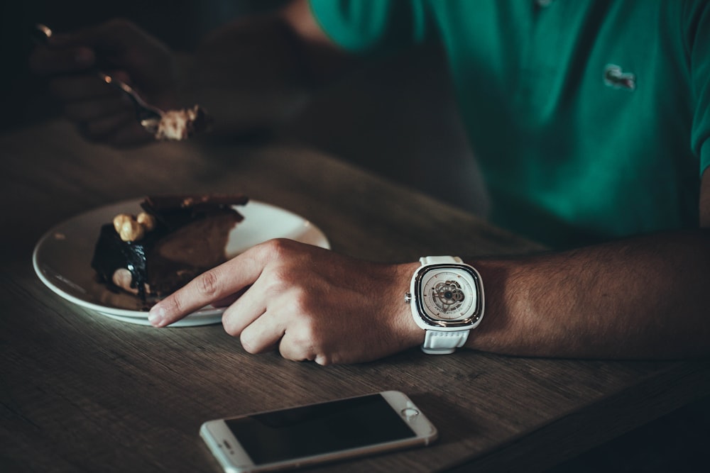 person holding stainless steel fork