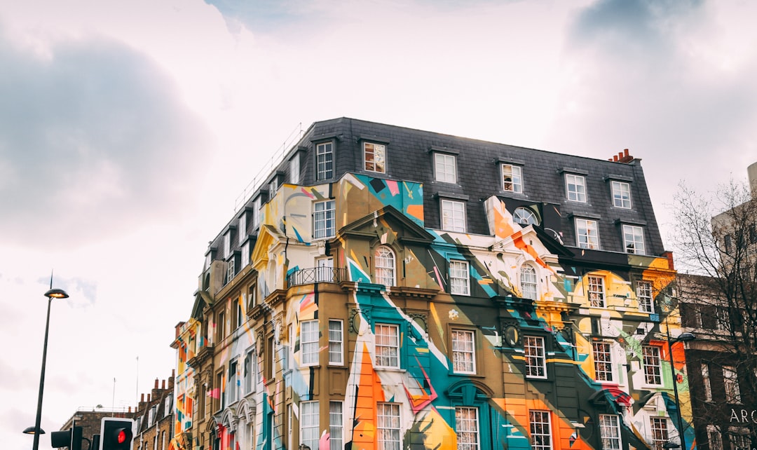 low-angle photography of building with art painting, shoreditch graffiti windows