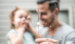 person holding sparklers