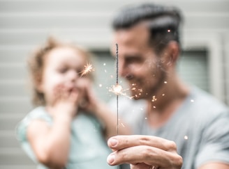 person holding sparklers