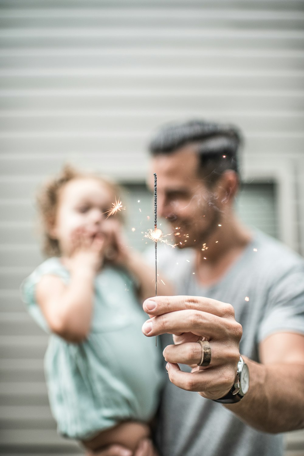 person holding sparklers