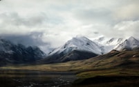 snow-capped mountain under sky