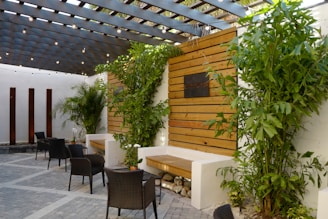 Outdoor terrace featuring clean lines, natural materials, and lush greenery.