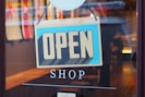gray and blue Open signage