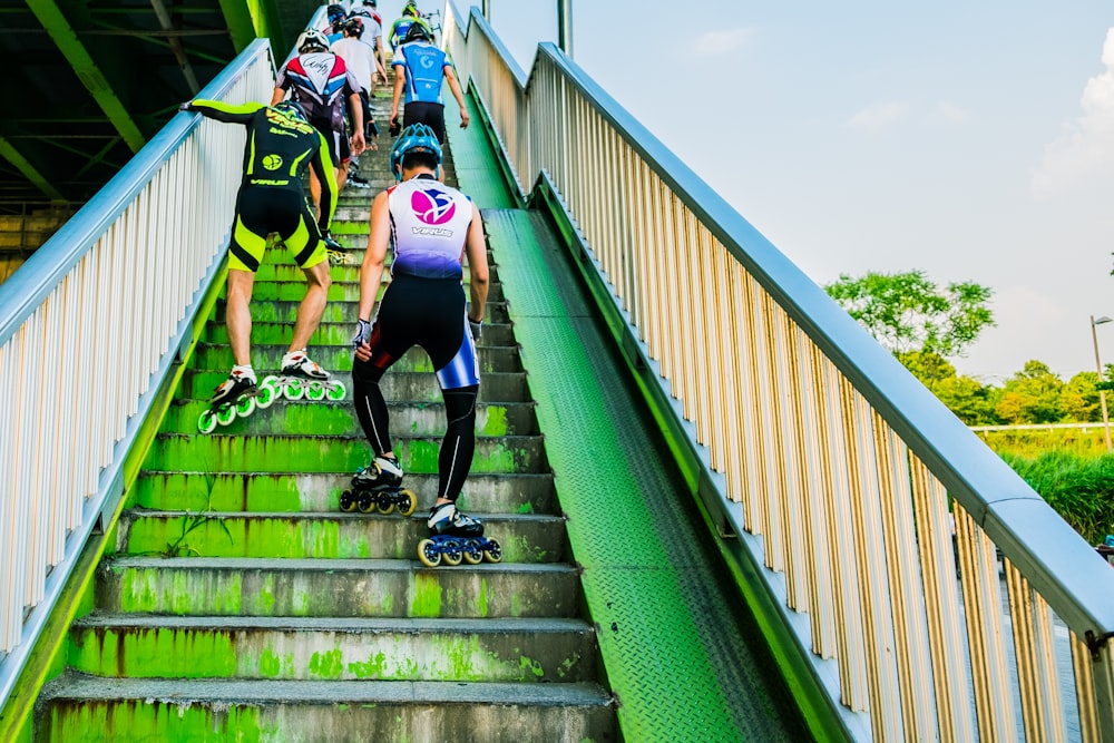 people wearing inline skates going upstairs