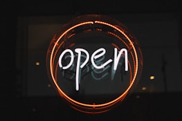 white and orange open LED signage turned on