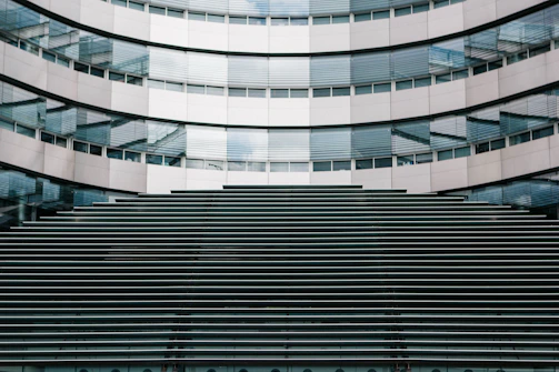 Modern commercial building facade featuring aluminum cladding with clean lines and reflective surfaces.