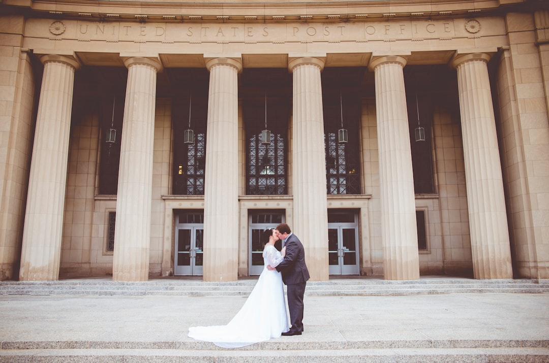 man kissing woman