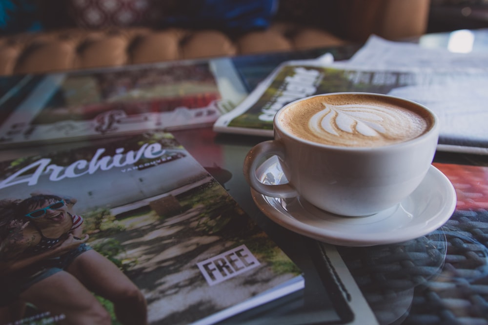 white ceramic cup on white ceramic saucer