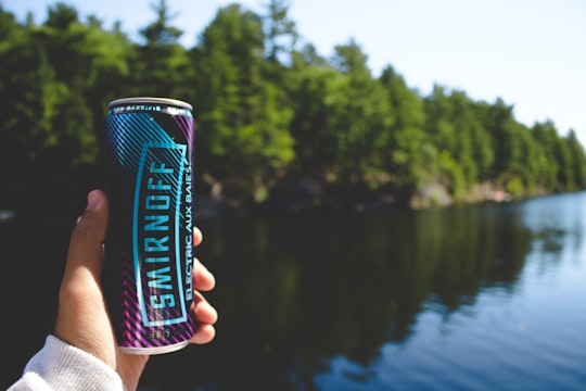 person holding Smirnoff can in Muskoka Canada