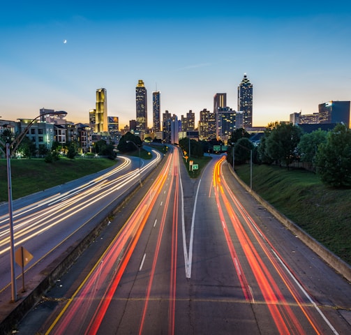 timelapse photo of highway during golden hour