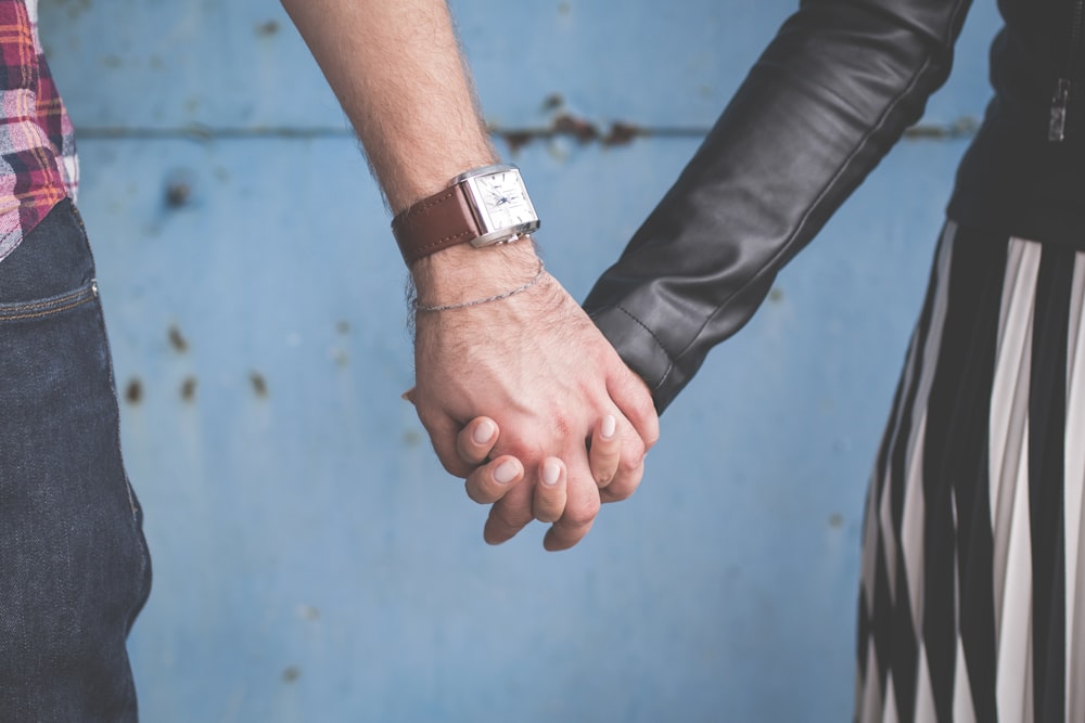 man and woman holding hands