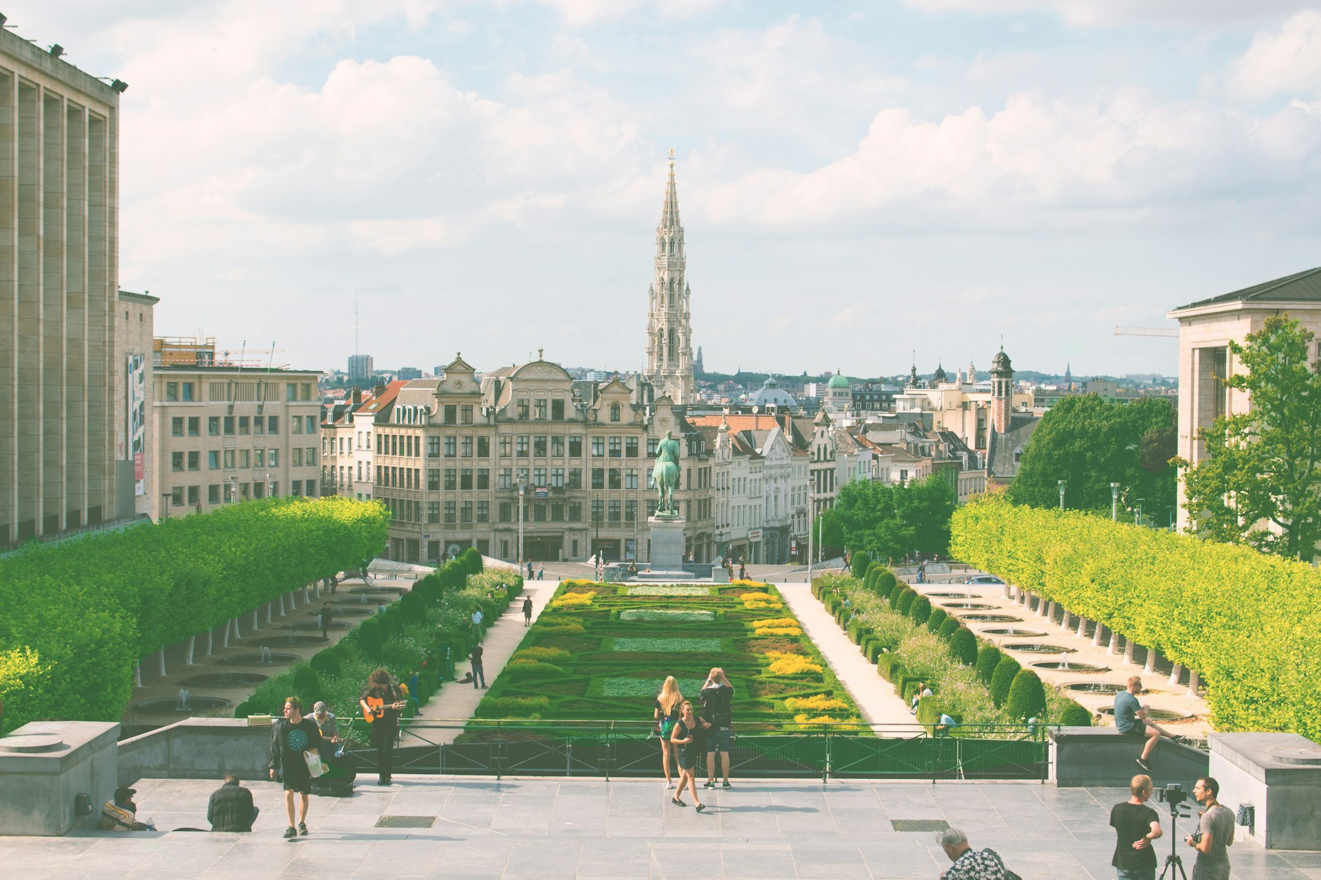 woman wearing yellow long-sleeved dress under white clouds and blue sky during daytime