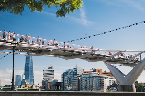 photo of people walking on bridge