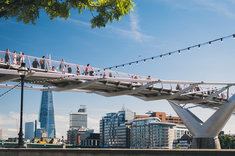 photo of people walking on bridge