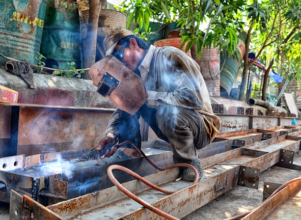man using welding machine