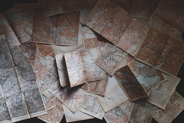 a lot of maps scattered around a space
