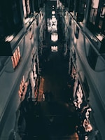 Close-up of sparkling polished floors reflecting overhead lights in a commercial building.