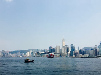 A panoramic shot of the Hong Kong skyline from the water.