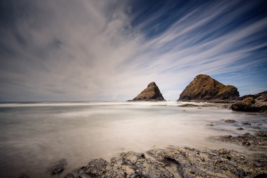 time lapse photography of boulder on body of water in Heceta Head Lighthouse State Scenic Viewpoint United States