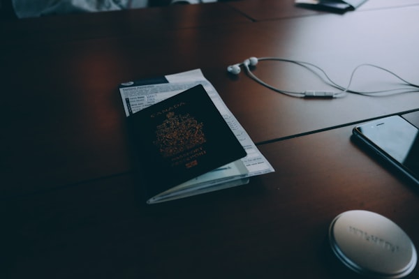 Professional office workspace with travel documents, representing FSAX Travel & Tours
