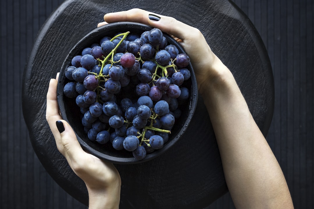 person holding bowl of grapes, Bowl of Grapes