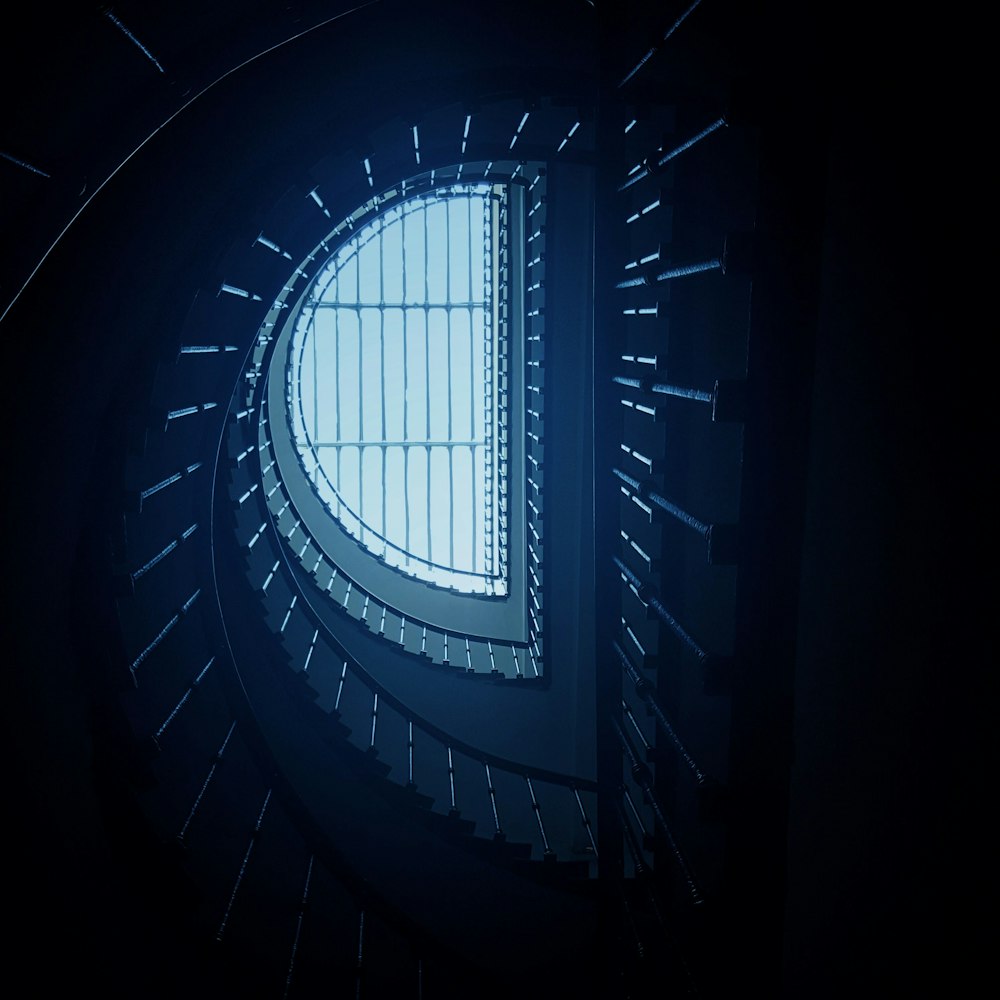 low-angle photography of spiral stairs