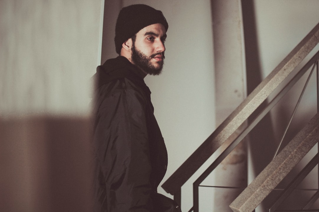 man standing near staircase