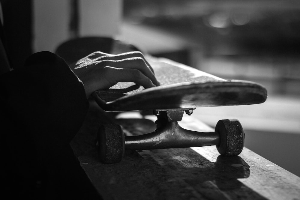 greyscale photography of skateboard
