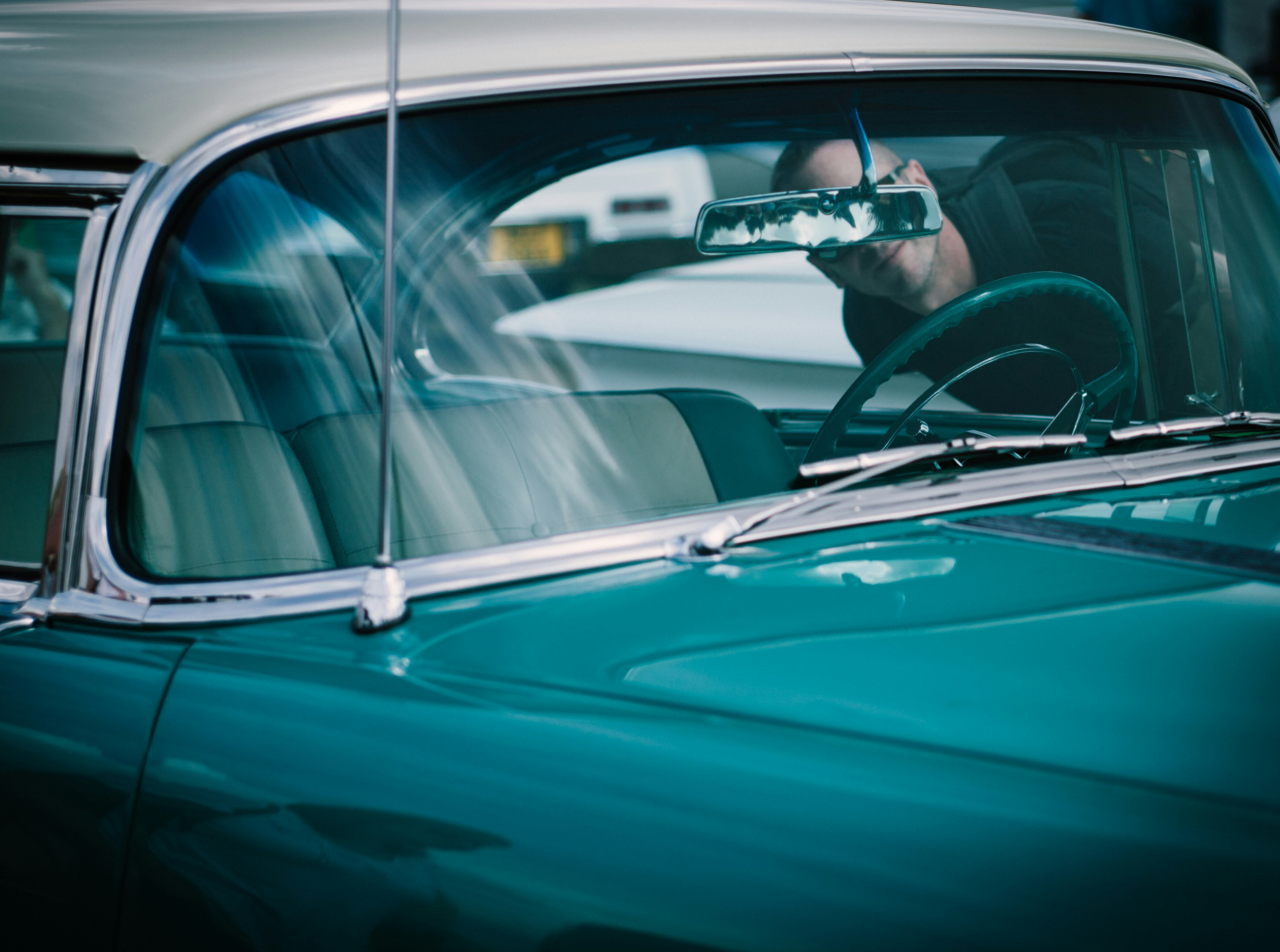 person looking at vehicle interior