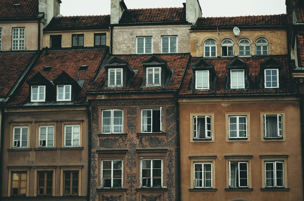 brown concrete buildings under gray sky