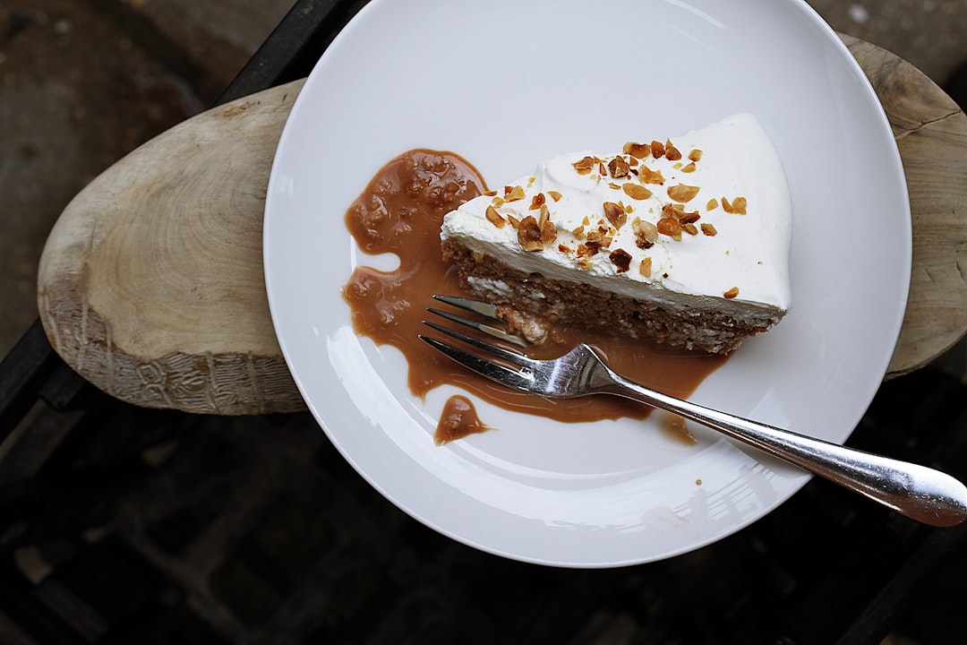 silver fork on round white ceramic plate, Caramel Cake