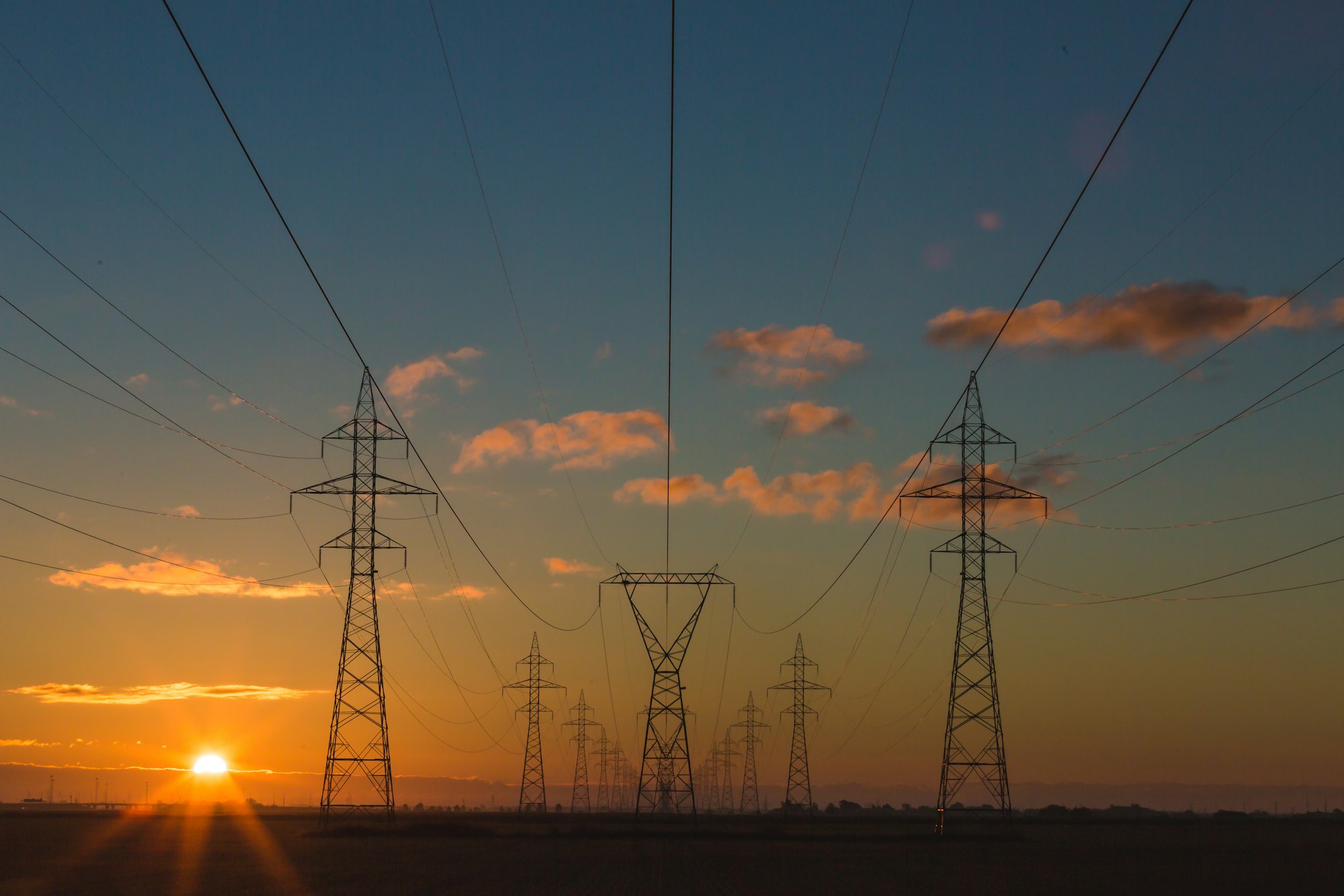 Power pylons at sunset