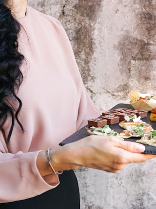 person holding tray with foods