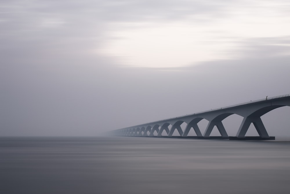 conjunction bridge under white sky